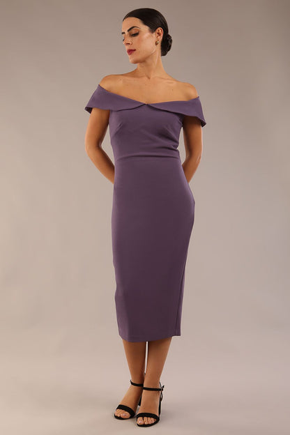 brunette model wearing diva catwalk juilet midaxi pencil sleeveless off shoulder dress with open neck and folded collar in colour mauve purple front