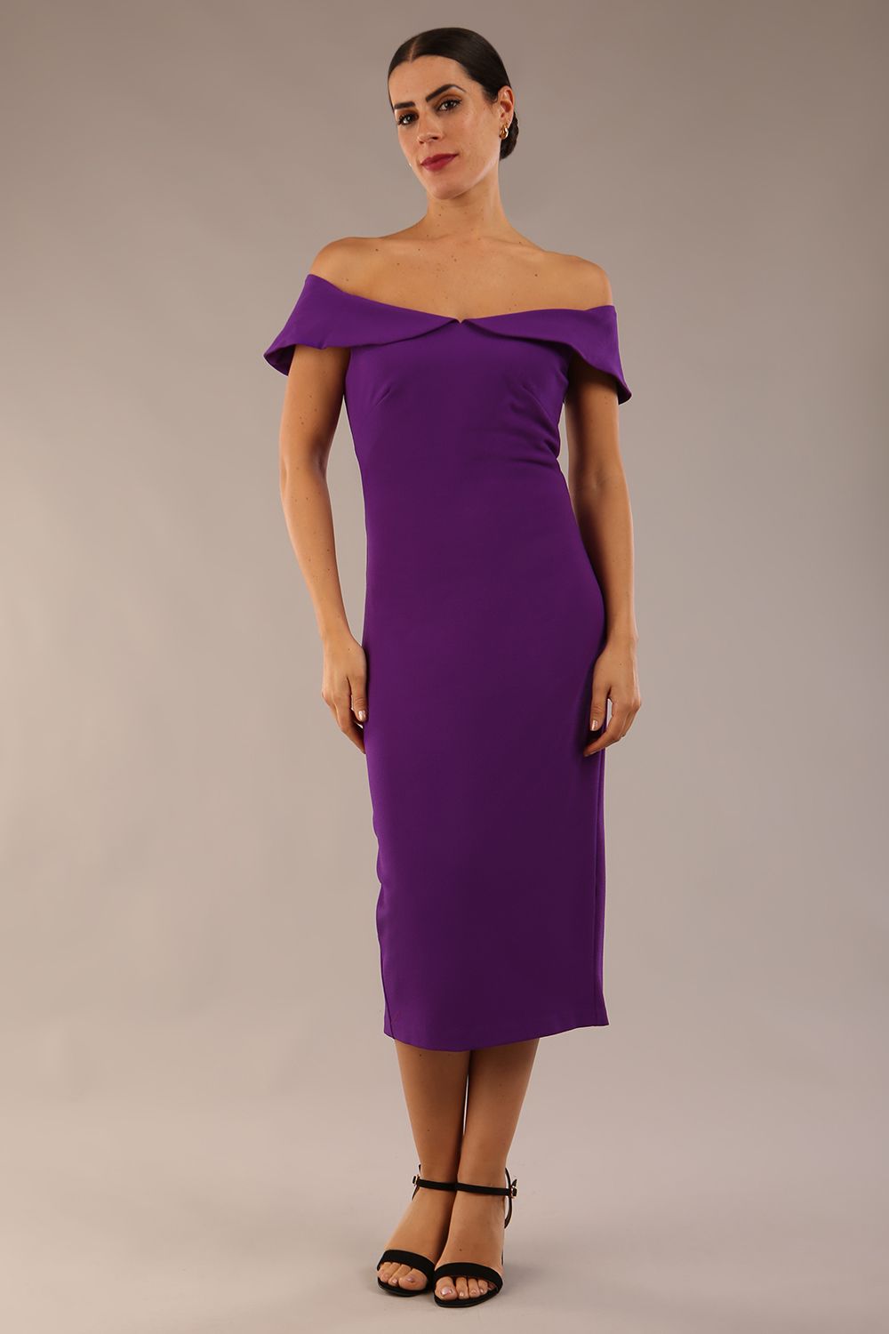 brunette model wearing diva catwalk juilet midaxi pencil sleeveless off shoulder dress with open neck and folded collar in colour passion purple front