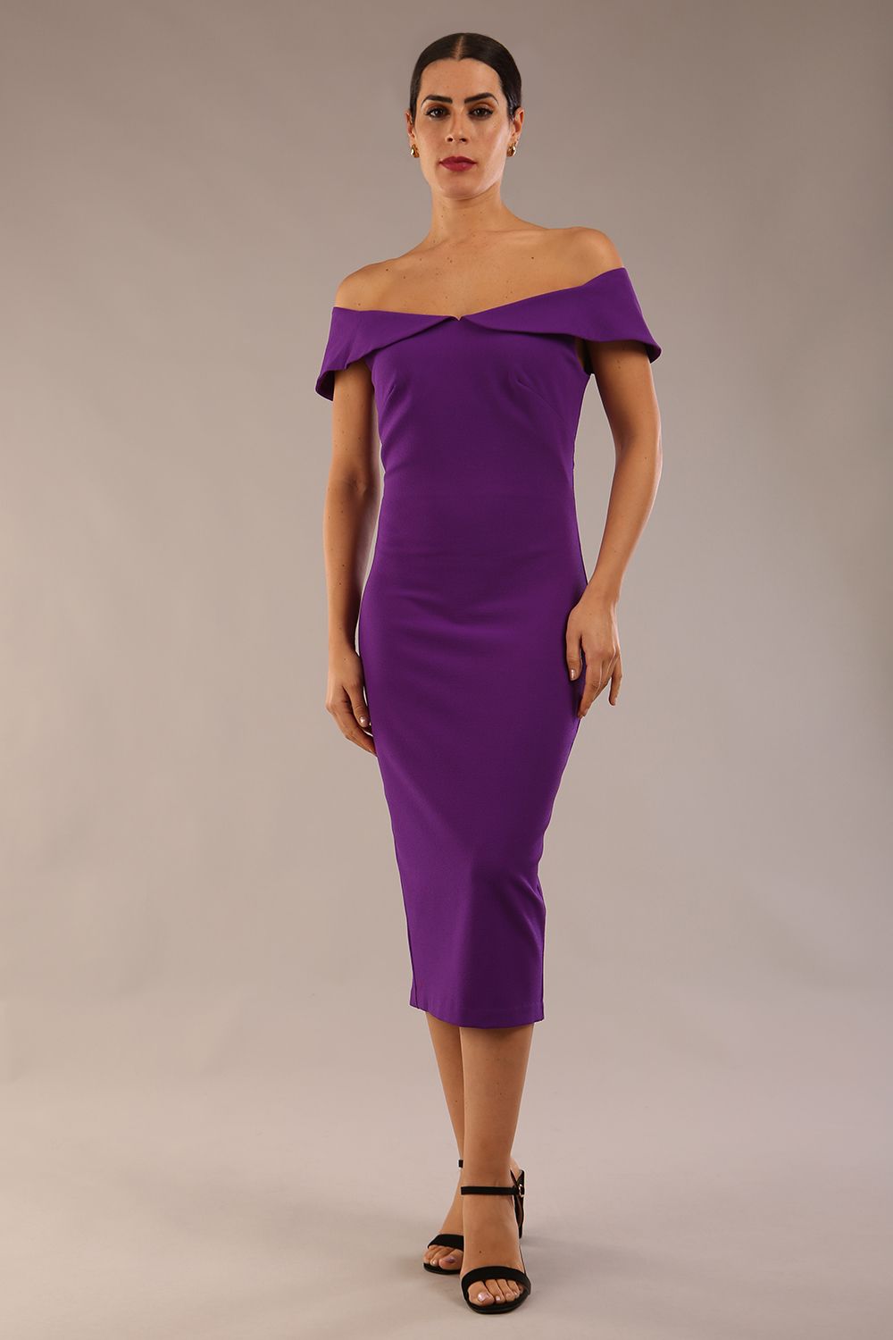 brunette model wearing diva catwalk juilet midaxi pencil sleeveless off shoulder dress with open neck and folded collar in colour passion purple front