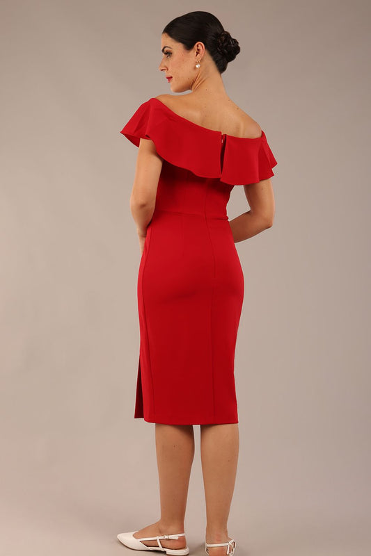 brunette model wearing diva catwalk pencil dress with off shoulder frilled front and bardot neckline in passion red  colour back