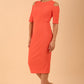 model is wearing diva catwalk solway pencil dress cold shoulder detail and rounded neckline in Sea Coral front side