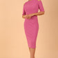 model is wearing diva catwalk solway pencil dress cold shoulder detail and rounded neckline in Begonia pink front 