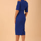 model is wearing diva catwalk solway pencil dress cold shoulder detail and rounded neckline in Cobalt Blue back side