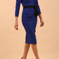 model wearing diva catwalk luma pencil skirt dress with contrasting bow off shoulder with sleeves in cobalt blue front side