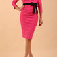 model wearing diva catwalk luma pencil skirt dress with contrasting bow off shoulder with sleeves in hibiscus pink front