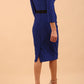 model wearing diva catwalk luma pencil skirt dress with contrasting bow off shoulder with sleeves in cobalt blue back side