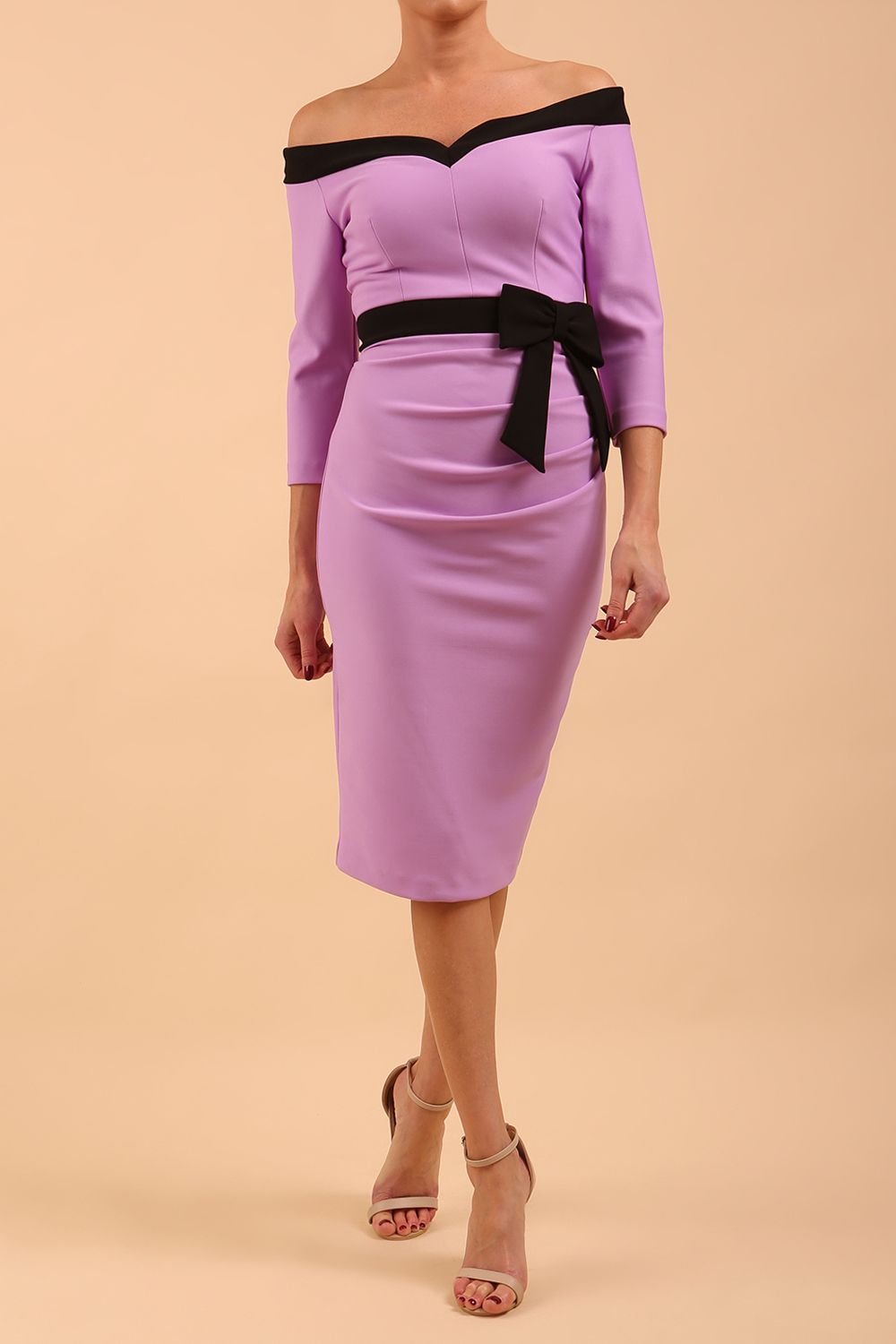 brunette model wearing diva catwalk luma pencil skirt dress with contrasting bow off shoulder with sleeves in Violet Bloom front