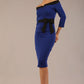 model wearing diva catwalk luma pencil skirt dress with contrasting bow off shoulder with sleeves in cobalt blue front