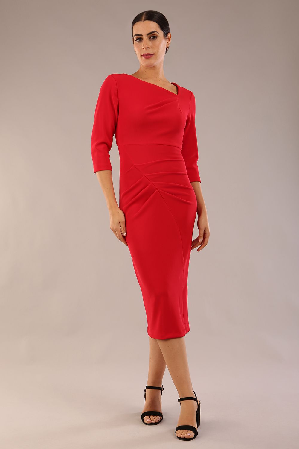 model is wearing a diva catwalk Amity Asymmetric Neckline Pleated front and back with 3/4 sleeves and front vent pencil Dress in True Red colour