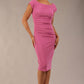 model is wearing diva catwalk polly cap sleeve pencil dress with rounded neckline at the front and deep lowered rounded cutout at the back in begonia pink front