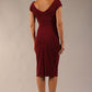 Model wearing Diva Catwalk Polly Rounded Neckline Pencil Cap Sleeve Dress with pleating across the tummy area in Cabaret Burgundy back