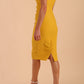 Model wearing Diva Catwalk Polly Rounded Neckline Pencil Cap Sleeve Dress with pleating across the tummy area in Mustard Yellow back side