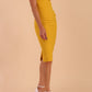 Model wearing Diva Catwalk Polly Rounded Neckline Pencil Cap Sleeve Dress with pleating across the tummy area in Mustard Yellow front side