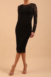 Model wearing a diva catwalk Montana Lace Dress with long lace sleeve and knee length with round lace neckline in Black colour front