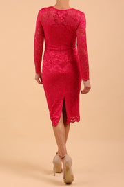 Model wearing a diva catwalk Montana Lace Dress with long lace sleeve and knee length with round lace neckline  in Yarrow Pink colour back