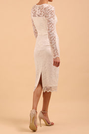 Model wearing a diva catwalk Montana Lace Dress with long lace sleeve and knee length with round lace neckline in Ivory Cream colour back