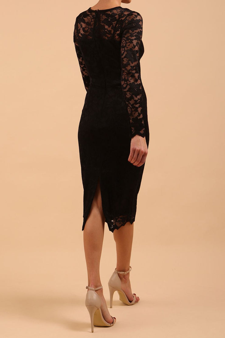 Model wearing a diva catwalk Montana Lace Dress with long lace sleeve and knee length with round lace neckline in Black colour back