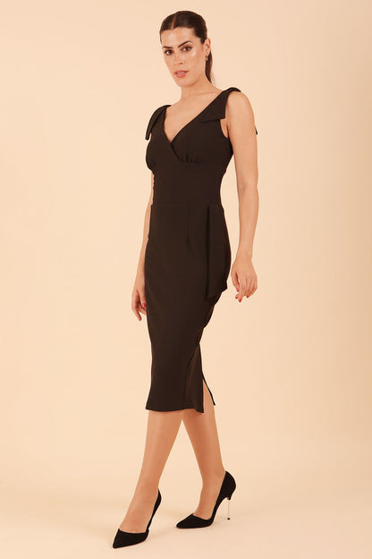 Model wearing diva catwalk Malvern Sleeveless Pencil Wiggle Dress with tie detail at waist and shoulders in Black colour side front