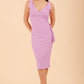 Model wearing diva catwalk Malvern Sleeveless Pencil Wiggle Dress with tie detail at waist and shoulders in Violet Bloom colour side front