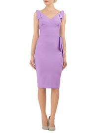 Model wearing diva catwalk Malvern Sleeveless  Pencil Wiggle Dress with tie detail at waist and shoulders in Violet Bloom colour side front