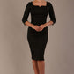 model is wearing a diva catwalk hathaway sweetheart neckline pencil dress in black against a plain background front view