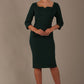 model is wearing a diva catwalk hathaway sweetheart neckline pencil dress in forest green against a plain background front view