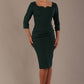 model is wearing a diva catwalk hathaway sweetheart neckline pencil dress in forest green against a plain background front view