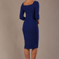 model is wearing a diva catwalk hathaway sweetheart neckline pencil dress in cobalt blue against a plain background back view