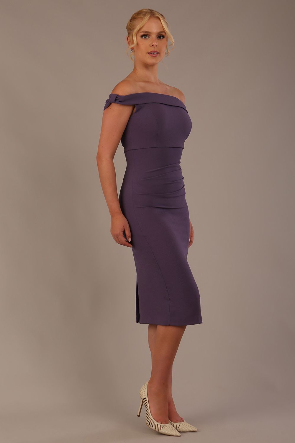 Model wearing the Diva Cloud Luxury Ripple Crepe cloud off-shoulder dress  design in dark mauve front image against a plain background