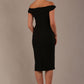 Model wearing the Diva Cloud Luxury Ripple Crepe cloud off-shoulder dress  design in black back image against a plain background