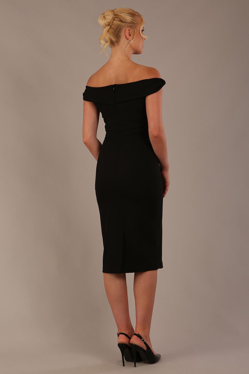 Model wearing the Diva Cloud Luxury Ripple Crepe cloud off-shoulder dress  design in black back image against a plain background