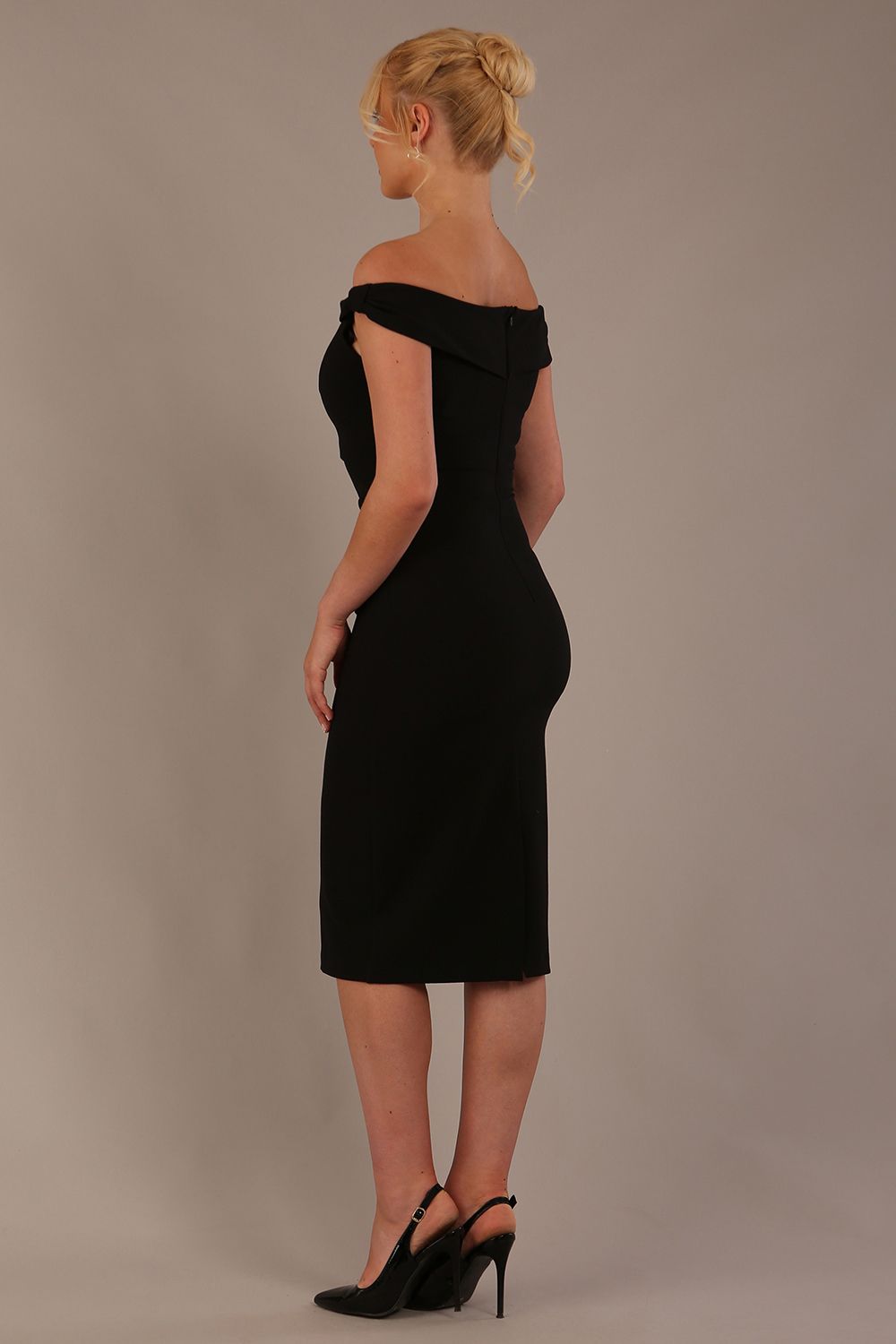 Model wearing the Diva Cloud Luxury Ripple Crepe cloud off-shoulder dress  design in black back image against a plain background