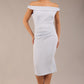 brunette model wearing a diva catwalk cloud pencil fitted flattering dress off shoulder sleeveless with detail with pleating around the front in celestial blue front