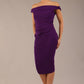 brunette model wearing a diva catwalk cloud pencil fitted flattering dress off shoulder sleeveless with detail with pleating around the front in deep purple front