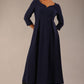 Brunette Model is wearing 3/4 sleeve sweetheart neckline swing navy blue dress