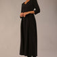 Brunette Model is wearing 3/4 sleeve sweetheart neckline swing black dress