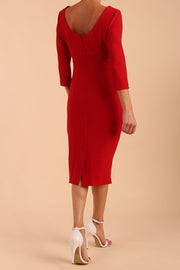 model is wearing diva catwalk polly sleeved pencil dress with low rounded neckline at the back in True Red back