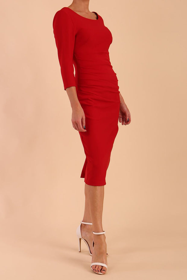 model is wearing diva catwalk polly sleeved pencil dress with low rounded neckline at the back in True Red front side