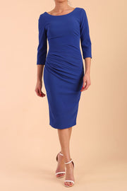 model is wearing diva catwalk polly sleeved pencil dress with low rounded neckline at the back in cobalt blue front