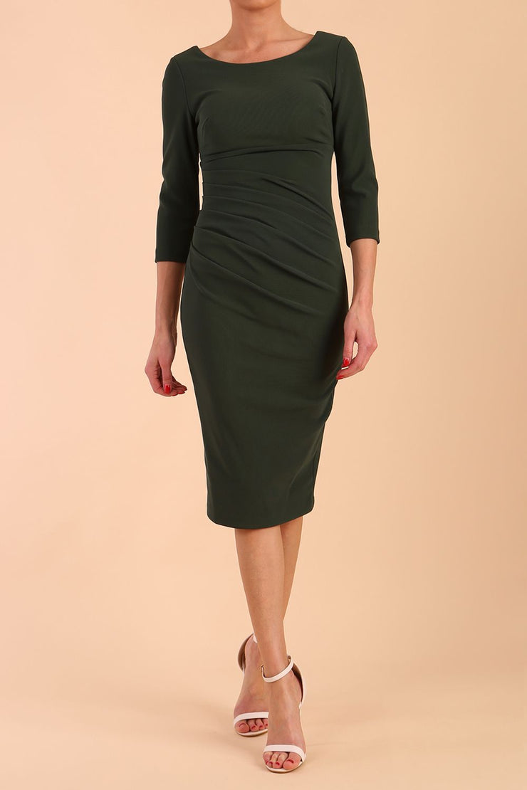 model is wearing diva catwalk polly sleeved pencil dress with low rounded neckline at the back in Deep Green front