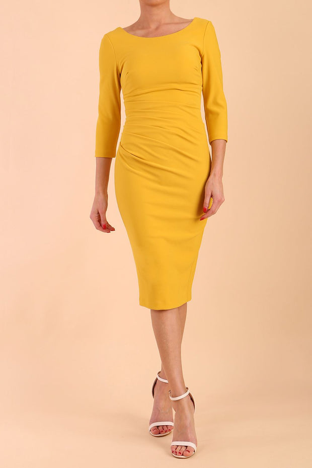 model is wearing diva catwalk polly sleeved pencil dress with low rounded neckline at the back in Mustard Yellow front