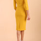 model is wearing diva catwalk polly sleeved pencil dress with low rounded neckline at the back in Mustard Yellow back