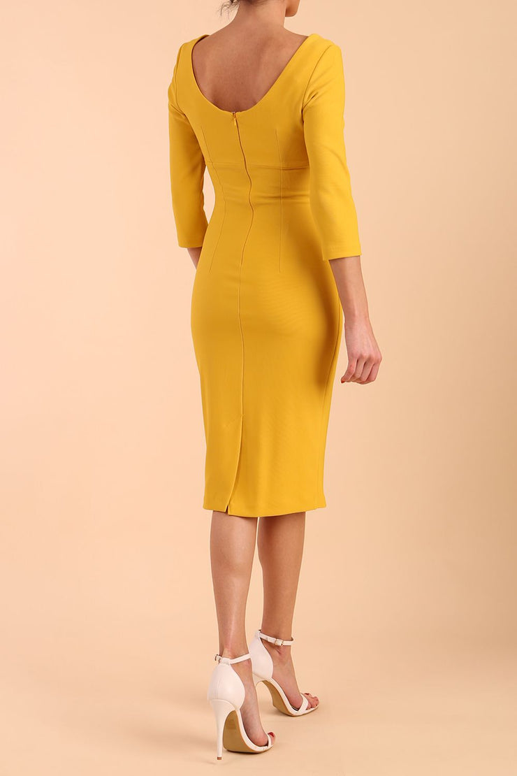 model is wearing diva catwalk polly sleeved pencil dress with low rounded neckline at the back in Mustard Yellow back