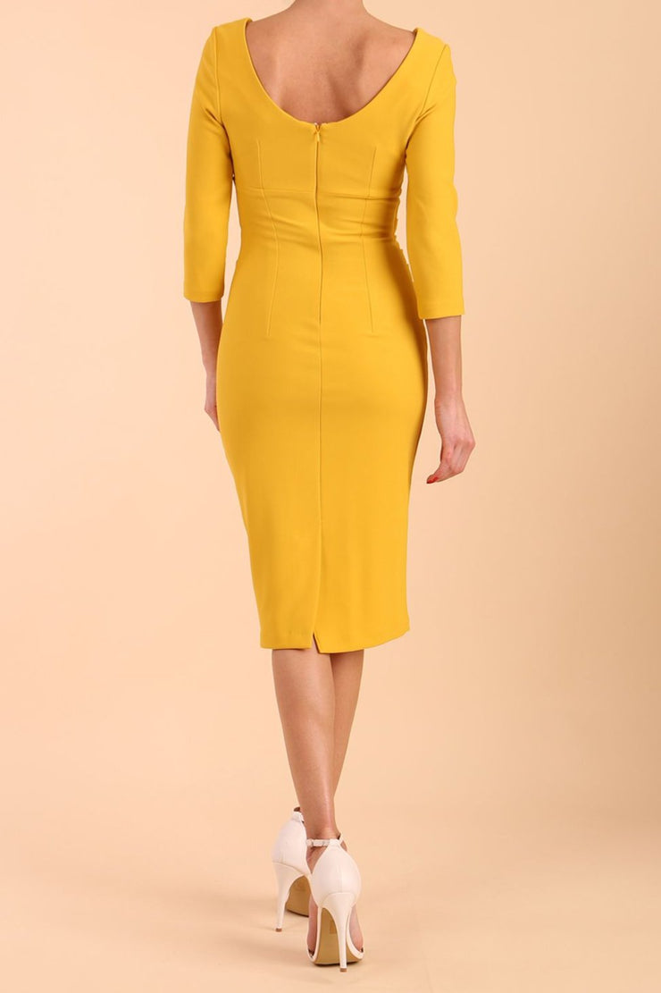 model is wearing diva catwalk polly sleeved pencil dress with low rounded neckline at the back in Mustard Yellow back