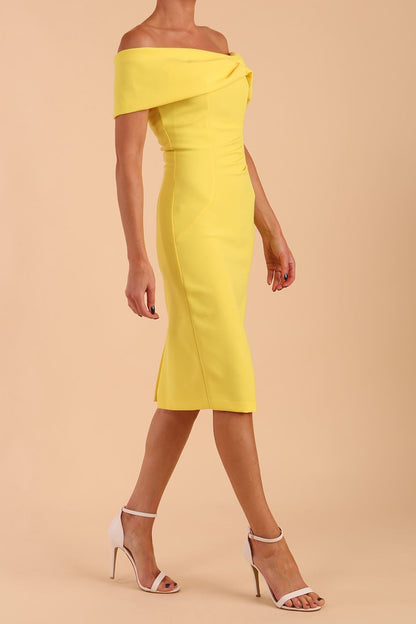 model is wearing diva catwalk mariposa pencil dress with Detailed Bardot neckline with fold-over detail and pleated at waist area in Blazing Yellow front side