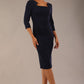 model is wearing diva catwalk quatro sleeved pencil dress with asymmetric wide cut our neckline in navy blue front