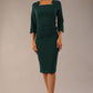 model is wearing diva catwalk quatro sleeved pencil dress with asymmetric wide cut our neckline in forest green front