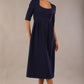 model wearing a diva catwalk Padstow Midi A-line Dress elbow length sleeves and midi length with empire waistline in navy blue colour