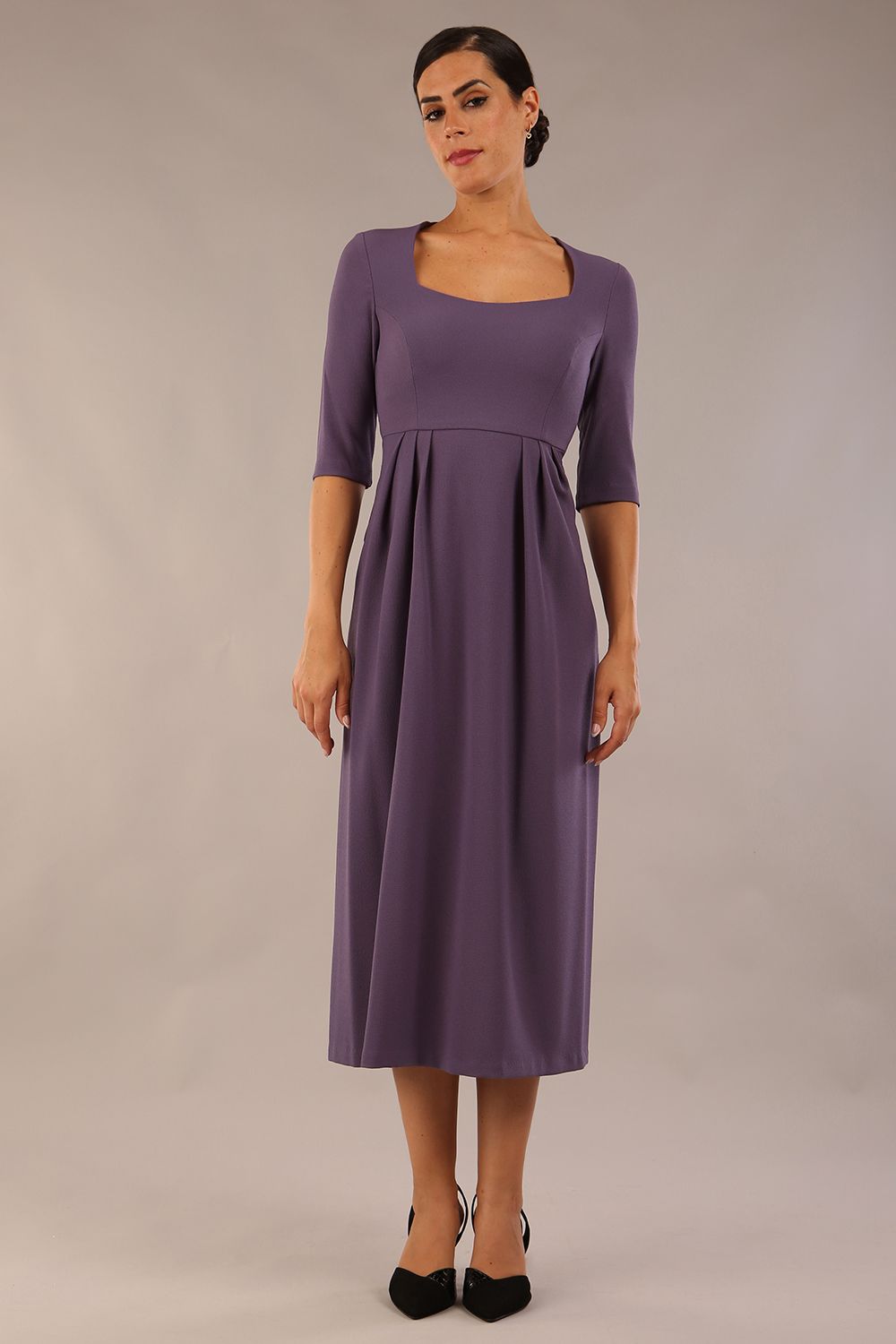 model wearing a diva catwalk Padstow Midi A-line Dress elbow length sleeves and midi length with empire waistline in dark mauve colour