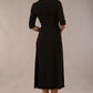 model wearing a diva catwalk Padstow Midi A-line Dress elbow length sleeves and midi length with empire waistline in black colour